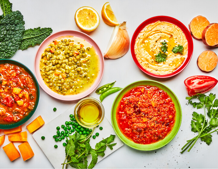 Four Soup & Grain bowls with their ingredients on the side