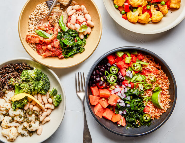 Four Soup & Grain bowls with their ingredients on the side