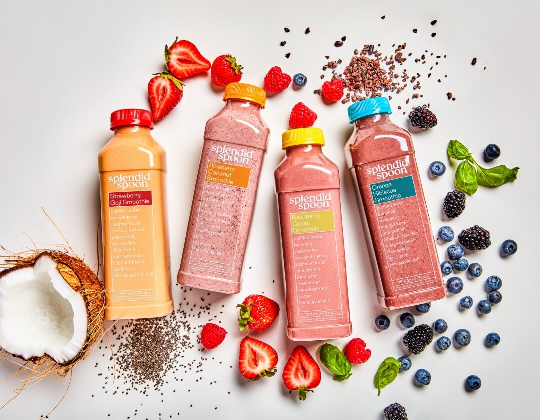 Four Smoothie bottles with their ingredients on the side