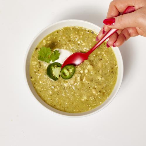 Person eating Green Tomatillo splendid spoon bowl