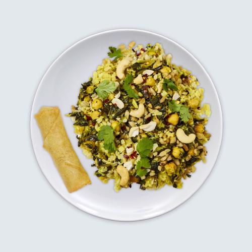 Coconut Curry Rice as seen from above in a white bowl on a white background