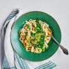 Creamy Spinach & Mushroom Noodles in a bowl with a fork in it and napkin on the side.