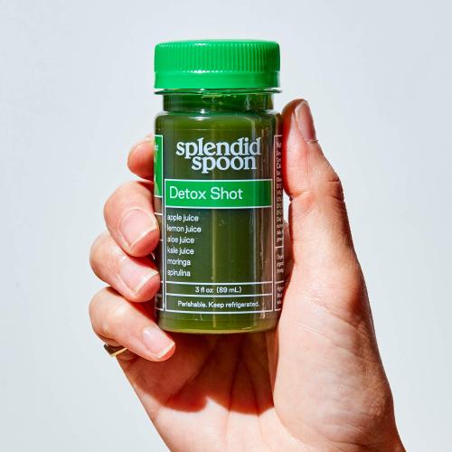 Hand holding Detox Shot