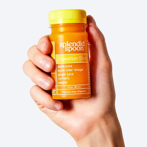 Hand holding a Digestion Shot