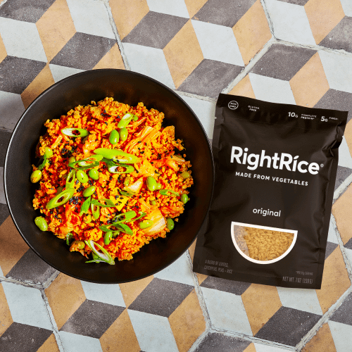 Kimchi Bowl with Right Rice bag on a colorful table.