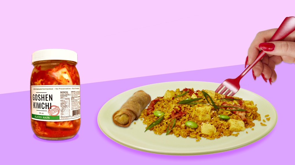 Kimchi Fried Quinoa on a white plate next to a jar of kimchi