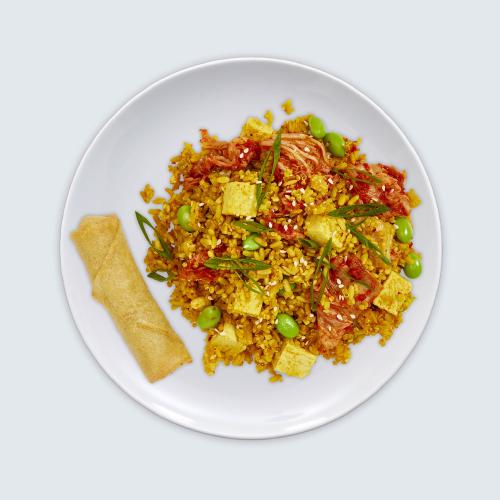 Kimchi Fried Quinoa as seen from above in a while bowl on a white background.