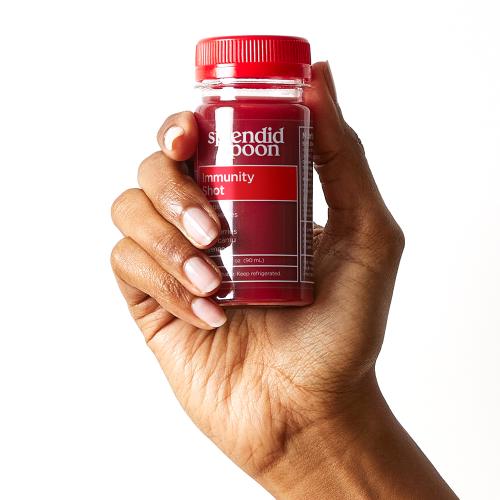 Hand holding an Immunity Shot